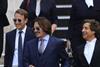 Johnny Depp leaving court with his barristers following libel case