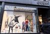 Banksy art in the window of Guess, Regent St