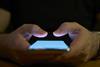 A man holds a phone in his hands