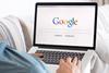Man uses Google on laptop