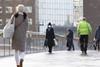 Commuters cross London Bridge during coronavirus pandemic