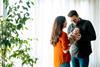 Couple cradle their newborn