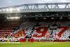 Liverpool fans hold up signs in reference to the 97 victims of the Hillsborough disaster inside the stadium before the Liverpool v Benfica match, April 13, 2022
