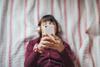 Child scrolling on social media on phone