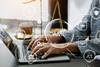 Anti-money laundering graphic over an image of justice scales and a laptop