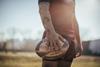 Rugby player holds a rugby ball