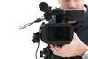 Camera man with recording equipment