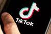 TikTok logo dispayed on a phone