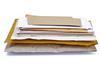 A pile of post in brown and white envelopes