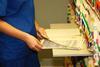 An anonymous doctor looks through hospital files
