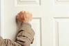 Man knocking on door