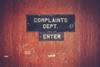 Complaints department sign