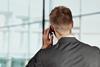 An anonymous businessman talks on the phone