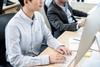 Young man working at desk in office