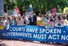Protesters outside the International Court of Justice after it issued its advisory on climate change in 2025