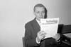 Tony Benn, Britain's Minister of Technology, holds a copy of a new publication, 'New Technology' (1967)