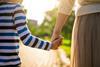 Parent and child holding hands
