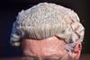Anonymous man wearing barrister wig