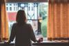 Woman looking out window