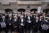 Criminal barristers begin strike action outside Old Bailey in row over legal aid fees