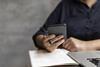 Student studying using phone and laptop