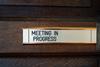 Meeting in progress door sign