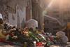Flowers and toys mark a Kyiv residential building that was destroyed by a Russian attack on 25 April, killing 12 people
