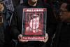 Protester seen holding a poster of Wang Quanzhang during the demonstration