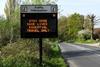 Traffic sign warning travellers to stay home during the coronavirus pandemic