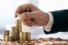 Businessman stacking coins