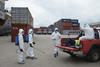 Health workers in protective suits conduct an Ebola prevention drill in Monrovia, Liberia
