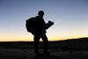 The silhouette of a British soldier on patrol