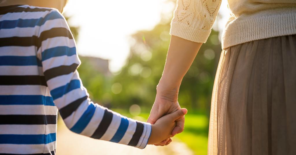 Parent and child holding hands