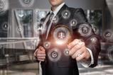 A man in a suit holds up a magnifying glass to a graphic of justice scales