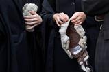 Barristers hold their wigs