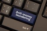Anti-money laundering button on computer keyboard