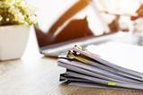 Pile of documents on desk
