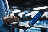 Office worker typing on laptop