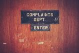 Complaints department sign