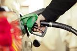 Pumping petrol into a car