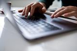 Person typing on laptop