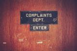 Complaints department sign
