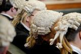 Anonymous female barristers wearing wigs