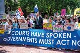 Protesters outside the International Court of Justice after it issued its advisory on climate change in 2025
