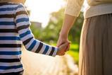 Parent and child holding hands
