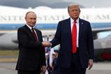 Russian President Vladimir Putin and US President Donald Trump shake hands in Alaska