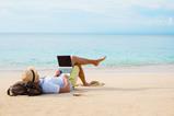 Man checking emails on the beach