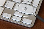 Justice scales on computer keyboard