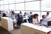 Colleagues working at their desks in an open-plan office