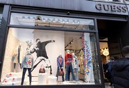 Banksy art in the window of Guess, Regent St